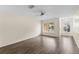 A cozy living room featuring hardwood floors, a ceiling fan, and bright natural light at 10807 Keys Gate Dr, Riverview, FL 33579