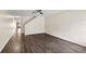 A spacious living room boasts hardwood floors, a ceiling fan, and neutral walls at 10807 Keys Gate Dr, Riverview, FL 33579