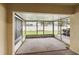 Empty screened-in patio overlooking the backyard at 10807 Keys Gate Dr, Riverview, FL 33579