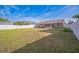Large backyard with a privacy fence and a screened in patio at 10841 Standing Stone Dr, Wimauma, FL 33598