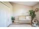 Bedroom features a crib, accent rug, closet, and large window providing great light at 10841 Standing Stone Dr, Wimauma, FL 33598