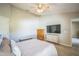Cozy bedroom featuring natural light, neutral walls, and a ceiling fan at 10841 Standing Stone Dr, Wimauma, FL 33598