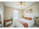 Cozy bedroom features a ceiling fan, natural light and neutral colors at 10841 Standing Stone Dr, Wimauma, FL 33598