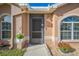 A close-up view of the front door and surrounding features, showcasing the home's entry at 10841 Standing Stone Dr, Wimauma, FL 33598