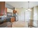 Bright kitchen area offering ample counter space, stainless steel fridge, and a dining area at 10841 Standing Stone Dr, Wimauma, FL 33598