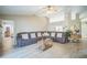 Spacious living room with vaulted ceilings, light-colored walls, and modern furnishings at 10841 Standing Stone Dr, Wimauma, FL 33598