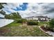 Well-maintained backyard with landscaped areas and a privacy fence at 11209 Kangley Ln, Spring Hill, FL 34608