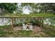 Backyard featuring a pergola with a stone bench at 11209 Kangley Ln, Spring Hill, FL 34608
