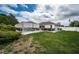 Expansive backyard with a screened-in pool and landscaped yard at 11209 Kangley Ln, Spring Hill, FL 34608
