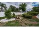 Backyard garden showcasing landscaping, privacy fence, and trees at 11209 Kangley Ln, Spring Hill, FL 34608