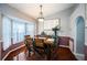Well-lit dining area features a modern light fixture and ample natural light at 11209 Kangley Ln, Spring Hill, FL 34608