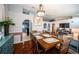 Warm dining room with wood table, arched doorway and modern decor at 11209 Kangley Ln, Spring Hill, FL 34608