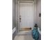 A close-up of the front door of the home, next to a statue, inviting entrance and secure access at 11209 Kangley Ln, Spring Hill, FL 34608