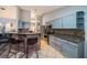 Modern kitchen with breakfast bar, stylish cabinets and granite countertops at 11209 Kangley Ln, Spring Hill, FL 34608