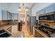 Kitchen with stainless steel appliances, light cabinets, and granite countertops at 11209 Kangley Ln, Spring Hill, FL 34608