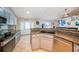 Bright kitchen featuring granite countertops, modern appliances, and a stylish backsplash at 11209 Kangley Ln, Spring Hill, FL 34608