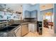Spacious kitchen features a modern sink, stainless steel dishwasher and granite counters at 11209 Kangley Ln, Spring Hill, FL 34608