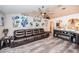 Comfortable living room featuring a leather sofa, fireplace, and neutral colors at 11209 Kangley Ln, Spring Hill, FL 34608
