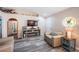 Cozy living room with modern flooring, entertainment center with fireplace and comfortable seating arrangement at 11209 Kangley Ln, Spring Hill, FL 34608