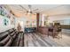 Open floor plan with connecting living room, kitchen, and archways with decorative elements at 11209 Kangley Ln, Spring Hill, FL 34608