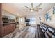 Open floor plan showing the kitchen, living room, and breakfast bar at 11209 Kangley Ln, Spring Hill, FL 34608