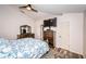 Comfortable main bedroom with wood flooring, neutral walls, and a ceiling fan at 11209 Kangley Ln, Spring Hill, FL 34608