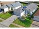 Aerial view of home with manicured lawns and landscaping, and dark roof at 11250 Hollander Ave, Hudson, FL 34667
