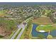 Community aerial view showcasing golf course, entry, and surrounding homes at 11250 Hollander Ave, Hudson, FL 34667