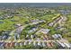 Scenic aerial view of a community with golf course and multiple ponds at 11250 Hollander Ave, Hudson, FL 34667