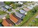 Aerial view showcasing a residential neighborhood with well-maintained homes and lush landscaping at 11250 Hollander Ave, Hudson, FL 34667