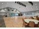 Spacious ballroom area with hardwood floors, large windows, and tables with chairs for social gatherings at 11250 Hollander Ave, Hudson, FL 34667