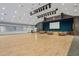 Large ballroom or event space featuring a stage, lighting, and ample space for gatherings and activities at 11250 Hollander Ave, Hudson, FL 34667