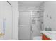 Clean bathroom featuring walk-in shower with white marble tile and built-in seat at 11250 Hollander Ave, Hudson, FL 34667