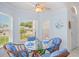 Cozy breakfast nook featuring bright, airy windows and a comfortable seating arrangement at 11250 Hollander Ave, Hudson, FL 34667