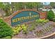 Welcoming entrance sign to Heritage Pines, an active 55+ country club living community at 11250 Hollander Ave, Hudson, FL 34667