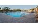 Large community pool with lounge chairs for residents to relax and enjoy the outdoor space at 11250 Hollander Ave, Hudson, FL 34667