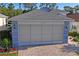 Charming home featuring a meticulously maintained lawn and paved driveway on a sunny day at 11250 Hollander Ave, Hudson, FL 34667