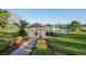 Picturesque gazebo with decorative trim overlooking the tranquil lake and fountain, adding charm to the community at 11250 Hollander Ave, Hudson, FL 34667