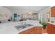 Bright kitchen with ample counter space, wood cabinetry, and seamless flow to living areas at 11250 Hollander Ave, Hudson, FL 34667