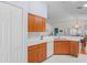 Bright kitchen featuring sleek appliances, generous counter space, and stylish cabinetry with a pantry at 11250 Hollander Ave, Hudson, FL 34667