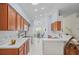 Well-lit kitchen featuring stainless steel appliances, ample cabinetry, and convenient breakfast bar at 11250 Hollander Ave, Hudson, FL 34667