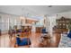 Bright open-concept living area with dining space, cozy seating, and access to a well-equipped kitchen at 11250 Hollander Ave, Hudson, FL 34667
