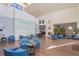 The community lobby has comfortable seating, high ceilings, and a cozy fireplace at 11250 Hollander Ave, Hudson, FL 34667
