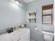 Well-lit bathroom with a white vanity, modern sink, and a decorative accent tile backsplash at 11396 Terrell Rd, Spring Hill, FL 34608