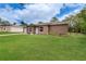 Charming single-story home with a well-maintained lawn, inviting entryway, and attached one car garage at 11396 Terrell Rd, Spring Hill, FL 34608