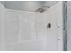 Modern shower with a rainfall shower head and built-in shelving at 11396 Terrell Rd, Spring Hill, FL 34608