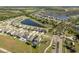 Community aerial view featuring serene water features, green spaces, and a well-planned residential layout and streetscapes at 11407 Acacia Grove Ln, Riverview, FL 33579