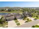 A lovely view of the single Gathering homes that dot the neighborhood plus a view of a small lake in the background at 11407 Acacia Grove Ln, Riverview, FL 33579