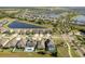 Panoramic aerial shot of a residential area highlighting the community layout, water features, and architectural styles at 11407 Acacia Grove Ln, Riverview, FL 33579