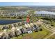 Wide aerial view of a Primary-planned community featuring lakes, walking trails, and well-maintained homes at 11407 Acacia Grove Ln, Riverview, FL 33579
